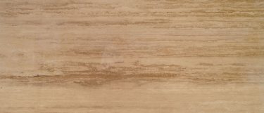 a torreon travertine countertop that has a warm neutral color toned surface