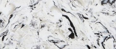 a countertop surface with swirls of black, gray, and blue over the white background