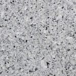 a Cold Spring quartz countertop that features black, gray, and white color speckled throughout the surface