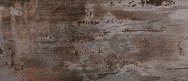 a trillium sintered stone countertop that has intense gray and black touches and volcanic stones design