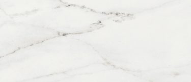 a rem sintered stone countertop surface that has intricate veining pattern in brown and gray with gold details over the white surface