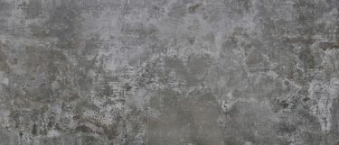 an Orix countertop surface that has a worn cement industrial design with a gray concrete finish