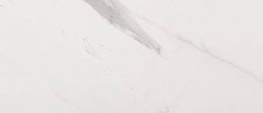 an olimpo sintered stone countertop surface that features gray veining pattern over the white background
