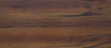 an odin sintered stone countertop surface that has dark brown tones blended with caramel and black in a wood like pattern