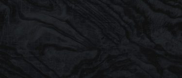 a Liquid embers sintered stone countertop that features a dark design with a swirled veining pattern over the dark blue surface