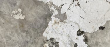 a Khalo sintered stone countertop surface that has flecks of cream and brown with spots in black and pale gold