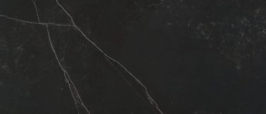 a Kelya sintered stone countertop surface that has a dark design with gray veins over the black background