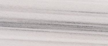 a Marmara White marble countertop surface that features linear veins of gray over the creamy white background