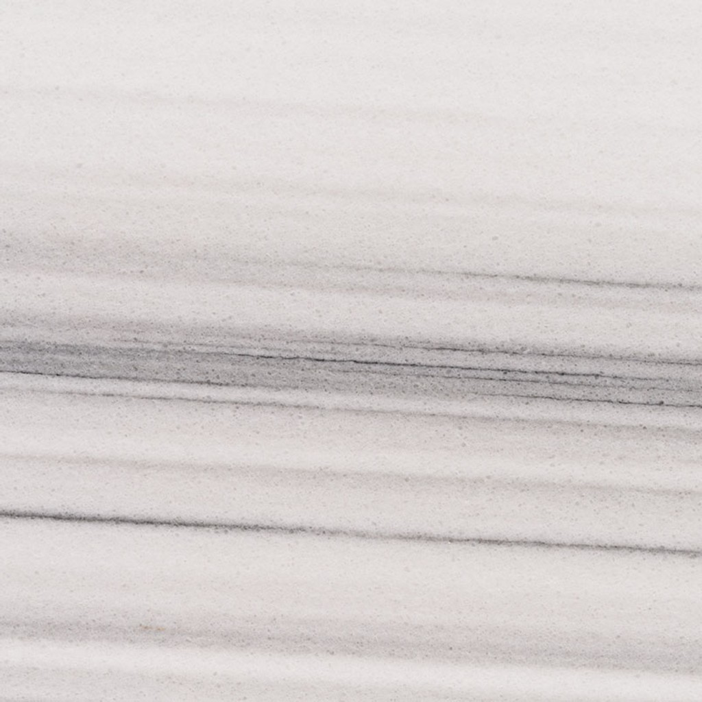a Marmara White marble countertop surface that features linear veins of gray over the creamy white background