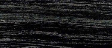 a Fantasy Black marble countertop surface that features white and gray linear veins over the dark black background