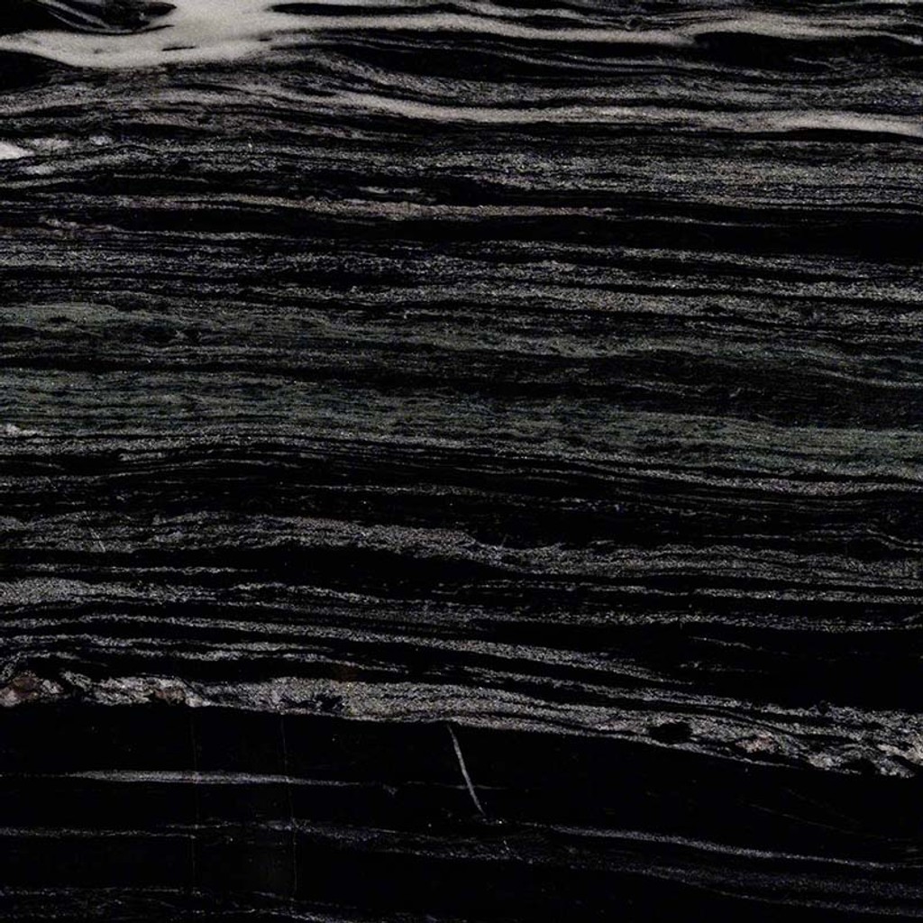a Fantasy Black marble countertop surface that features white and gray linear veins over the dark black background