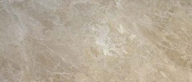 an Emperador Light marble countertop surface that has creamy and brown tones