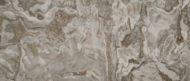 an Avalanche White marble countertop surface that has swirls of white, gray, and gold