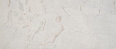 an Arabescato Venato marble countertop surface that features veining pattern in silver, gray, and brown over the white background