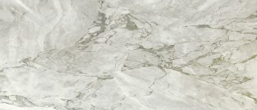 a riovalli marble countertop surface that has a warm white base with gray veining pattern
