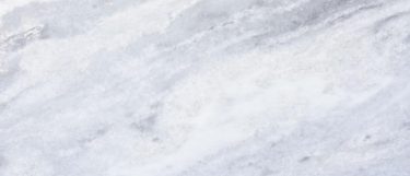 a shadow storm marble countertop that features dark gray steaks throughout its white surface