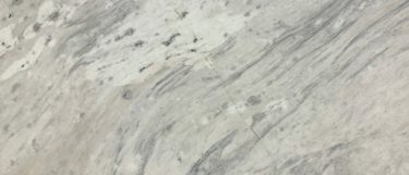 a Circo White marble countertop surface that features ray details over the white background