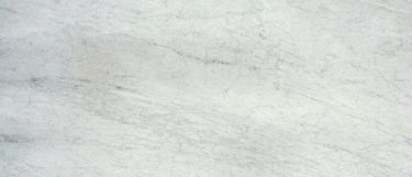 a Carrara White marble countertop surface that features shades of gray and white