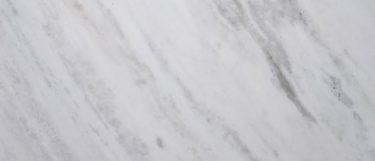 a stormy night countertop surface that has intricate veining pattern in black and gray