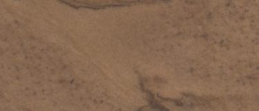 a Mojave Sands quartzite countertop surface that has rich rust sand hues and dark wave pattern over the golden brown background