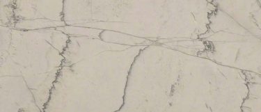 a Calacatta Macaubas quartz countertop surface that features smoky gray veins over the soft white background