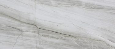 a Mykonos quartzite countertop surface that has thin veins in silver and gray over the light creamy white background