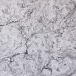 a stone countertop surface that blends swirls of white, grays, and black
