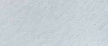 a Volakano quartz countertop surface with light, warm veins running through the white background