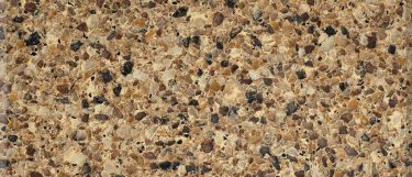a tiger eye quartz countertop that combines rich ocre, golden brown, and grays in pebble pattern on its surface