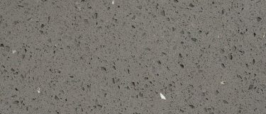 a sparkling grey quartz countertop surface that has sparkling flecks over the soft gray background
