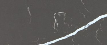 a Pietra grey quartz countertop surface that has a dark design with white veining over the gray background