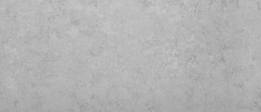 a Naxos quartz countertop surface that has a light gray color with a swirling pattern of light and dark grays