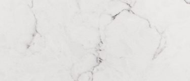 a Misterio quartz countertop surface that has a white background with brown and gray veining pattern