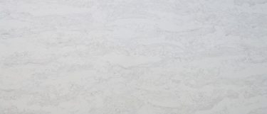 a Luna Plena quartz countertop surface that featues a design similar to a moon's gentle glow, with white color and silver or light gray details