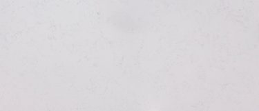 a Hestia quartz countertop surface that features soft gray veins over the white base
