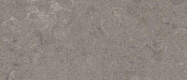 a Grey Emperador quartz countertop surface that has a grey background with white cloud details and dark gray patches