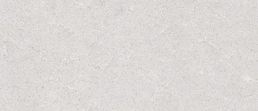 a Galaxy quartz countertop surface that has dark gray flecks over the light gray background