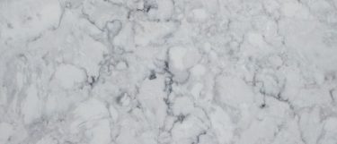 an Eclipse quartz countertop that combines color of white and dark gray with thin and light veins throughout the surface