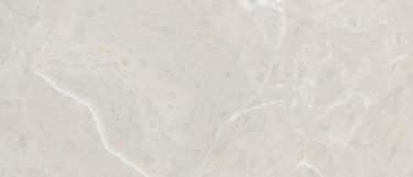 a Dolce Vita quartz countertop surface that features subtle tones of peach and gray over the ivory white background