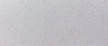 a Denali quartz countertop surface that features gold veins over the white background