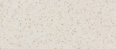 a Crystal Salt quartz countertop surface that features glass-like fragments and flecks over the creamy background