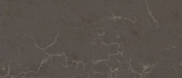 a Cinza quartz countertop surface that features veins over the gray background