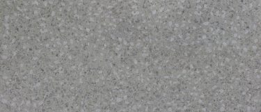 a Ceppo Di Gre quartz countertop surface that features a mosaic design with the blend of white and medium gray over the dark gray background