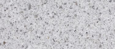 a Castelo quartz countertop surface that features specks over the grayish white background