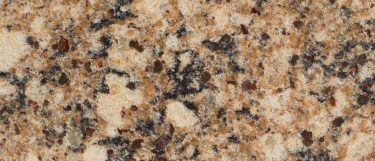an abstract painting against the white wall surface and a sink over the Cayman Brown countertop