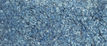 an Azur De Mar quartz countertop surface that has a an ocean blue color with dark vein details
