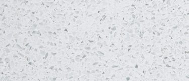 a white diamond quartz countertop surface with specks of gray against its white base color