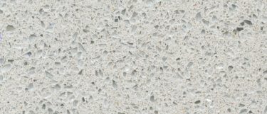 a stellar blanco quartz countertop surface that features white and gray grains over the white background