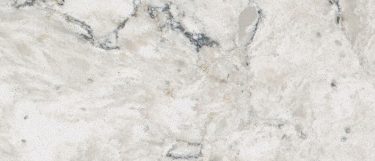 a Pietra quartz countertop surface that has a white base with faint veining in gray, blue, and cream tones