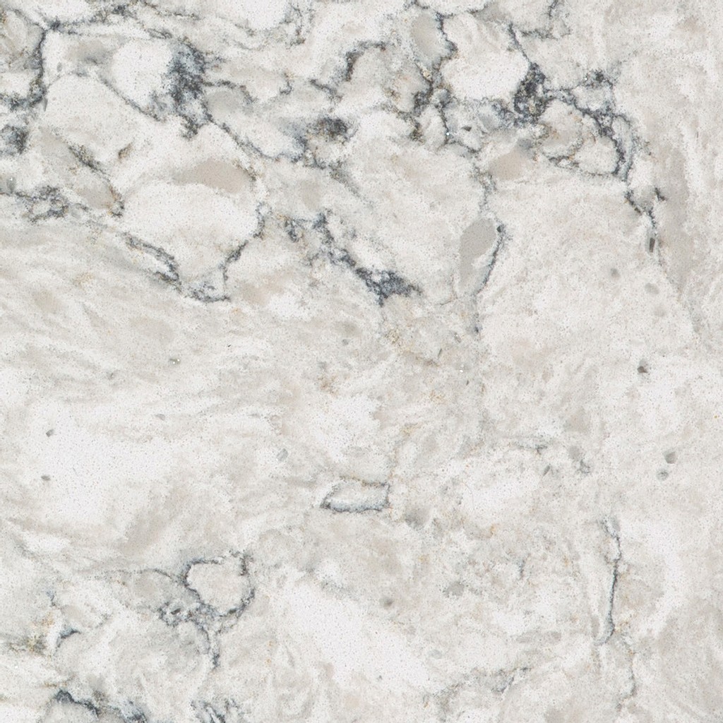 a Pietra quartz countertop surface that has a white base with faint veining in gray, blue, and cream tones